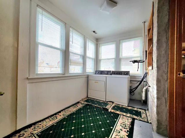 a kitchen with a refrigerator and window