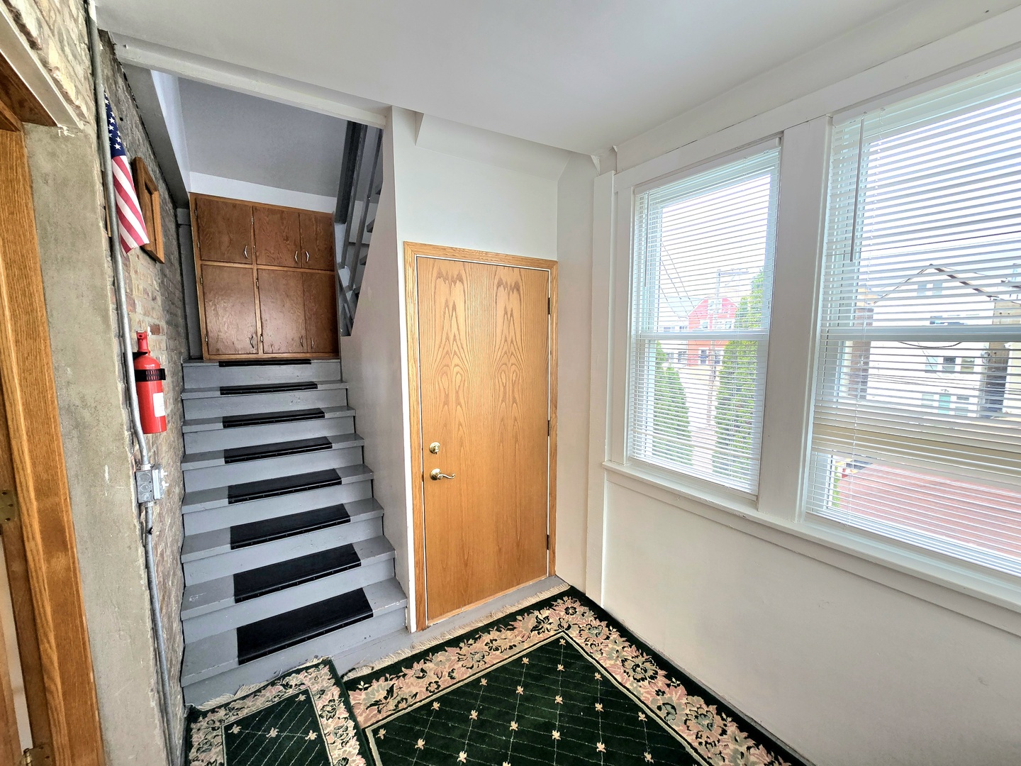 2126 West 24th Street, Unit 2 Chicago, IL 60608 - Photo 16 of 16 a view of an entryway with wooden floor and windows