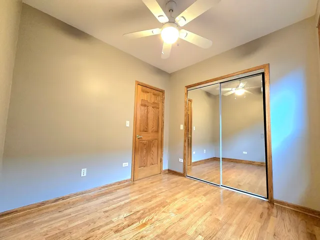 a view of an empty room with glass door