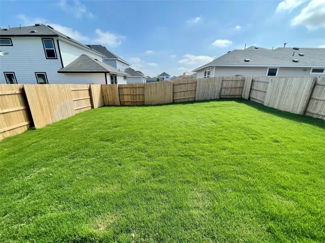 a view of a backyard with a small cabin