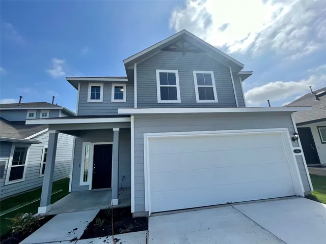 a front view of a house with garage