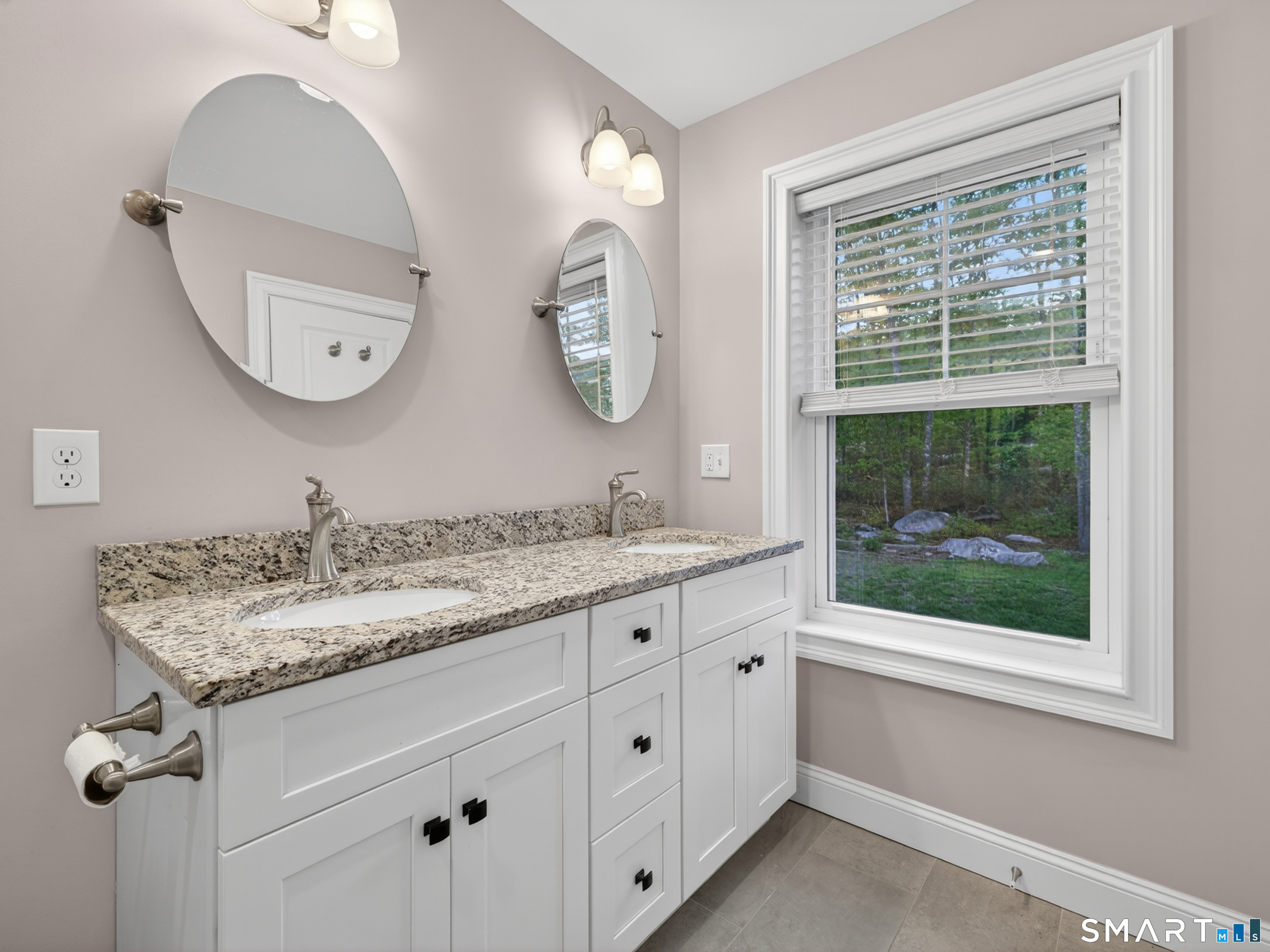 34 Village Crossing, Unit 34 Niantic, CT 06357 - Photo 25 of 38 a bathroom with a granite countertop toilet a sink and a mirror