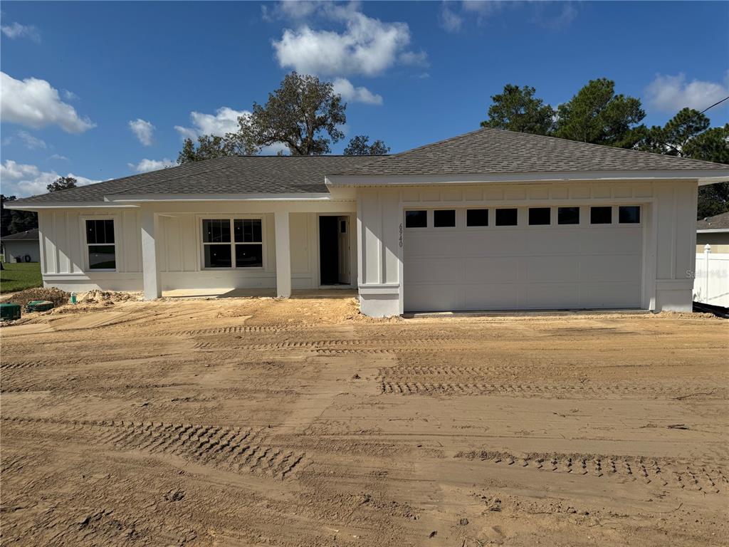 6940 Hemlock Road Ocala, FL 34472 - Photo 1 of 1 a view of a house with a wooden fence