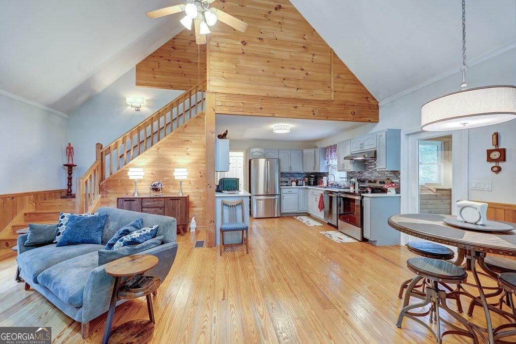 154 Rhapsody Circle Ellijay, GA 30540 - Photo 13 of 64 a living room with furniture and kitchen view