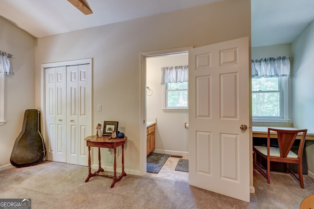 154 Rhapsody Circle Ellijay, GA 30540 - Photo 27 of 64 a living room with furniture a window and a potted plant