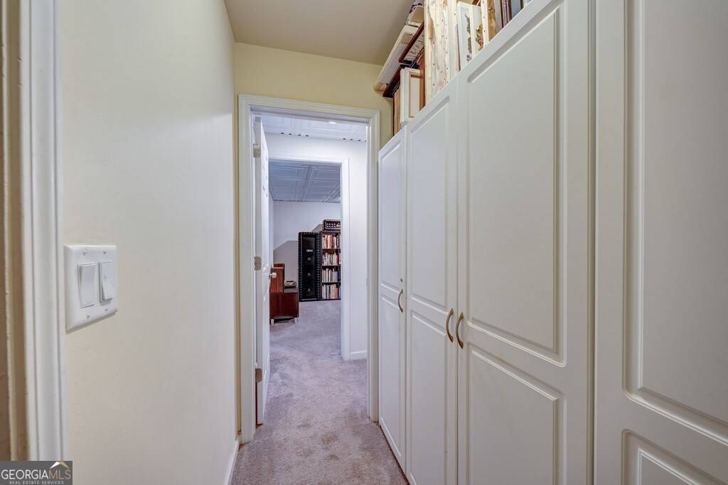 154 Rhapsody Circle Ellijay, GA 30540 - Photo 30 of 64 a view of a hallway with closet and a livingroom view