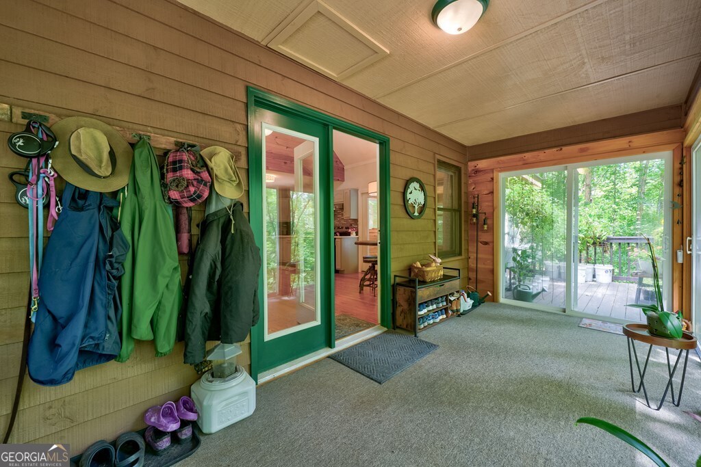 154 Rhapsody Circle Ellijay, GA 30540 - Photo 38 of 64 a living room filled with furniture and gym equipment