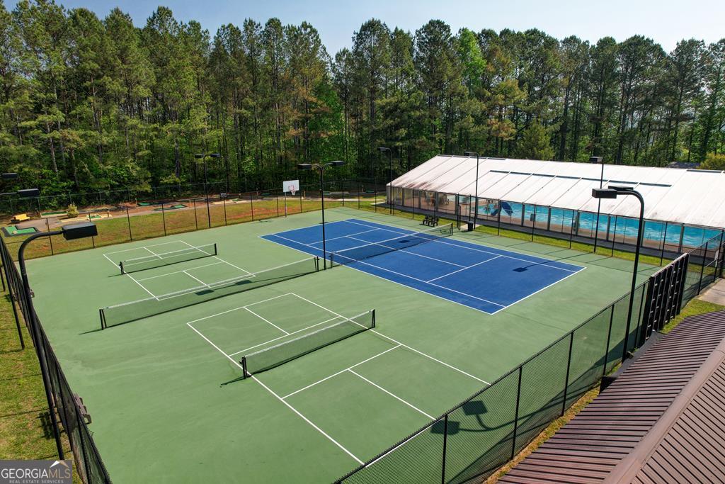 154 Rhapsody Circle Ellijay, GA 30540 - Photo 58 of 64 a view of a tennis ground with large trees