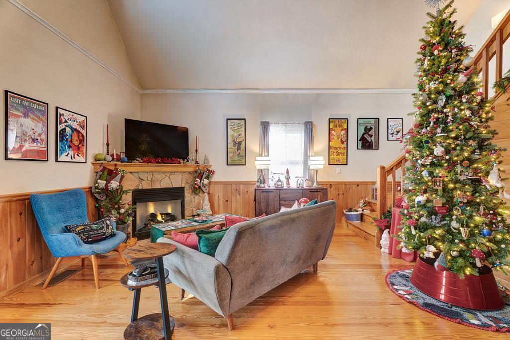 154 Rhapsody Circle Ellijay, GA 30540 - Photo 8 of 64 a living room with furniture a flat screen tv and a fireplace