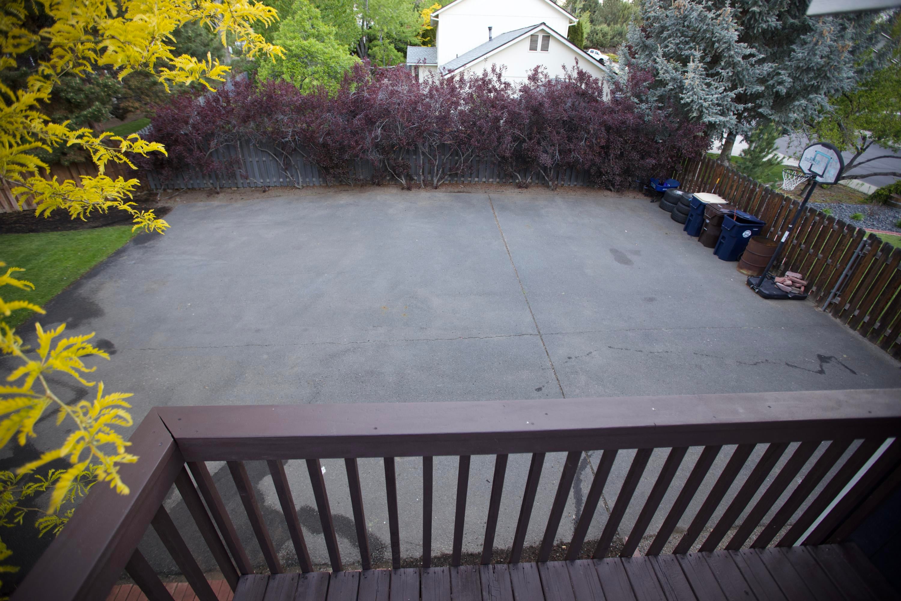 3608 Southwest Volcano Court Redmond, OR 97756 - Photo 34 of 47 Deck view overlooking the backyard paved parking.