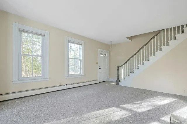 a view of an empty room with windows