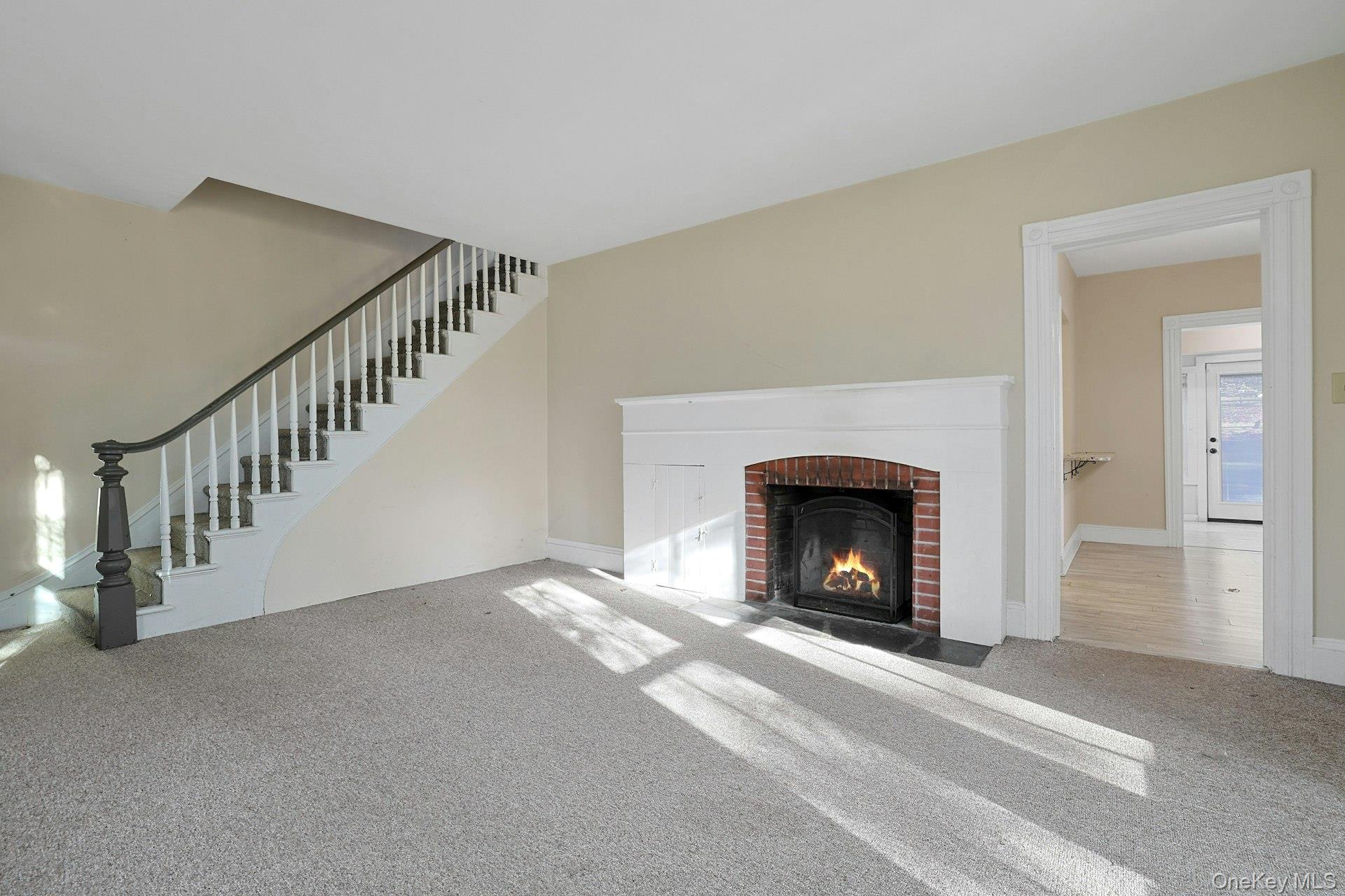 46 Mile Road Montebello, NY 10901 - Photo 15 of 27 a view of an empty room with fireplace and a window