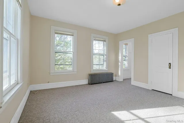 a living room with furniture and windows