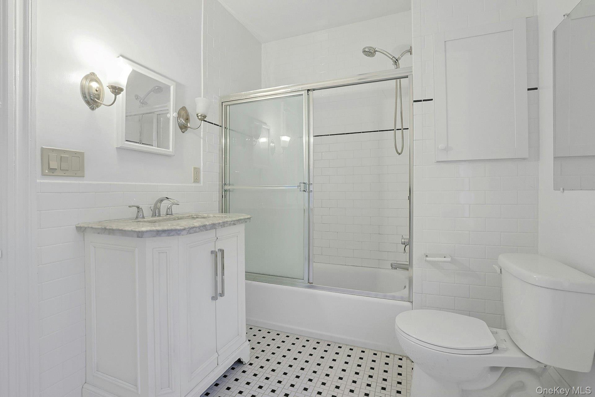 46 Mile Road Montebello, NY 10901 - Photo 17 of 27 a bathroom with a granite countertop sink toilet and shower