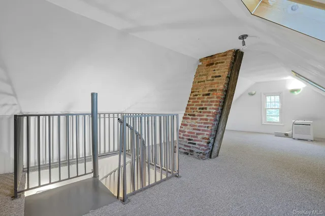 a view of an empty room with stairs