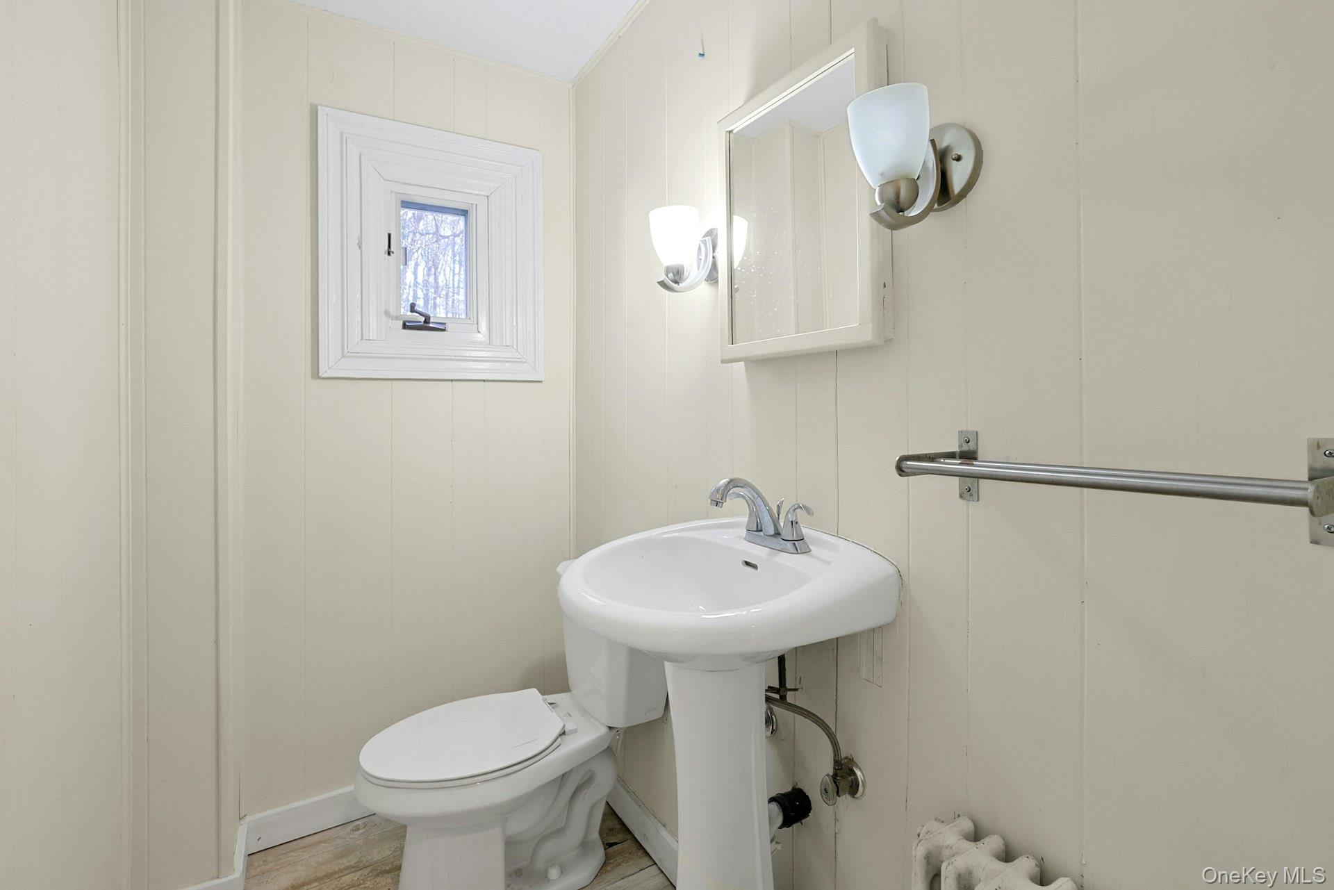 46 Mile Road Montebello, NY 10901 - Photo 22 of 27 a bathroom with a sink a toilet and mirror