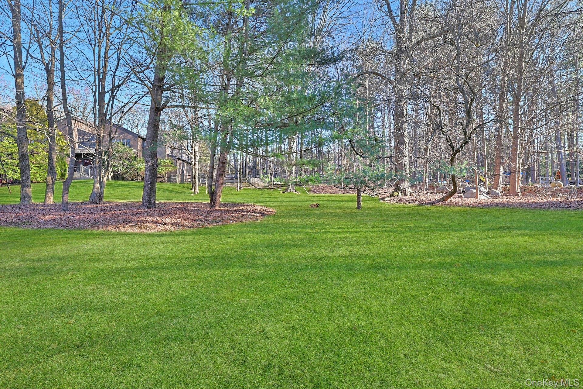 46 Mile Road Montebello, NY 10901 - Photo 24 of 27 a building with trees in the background