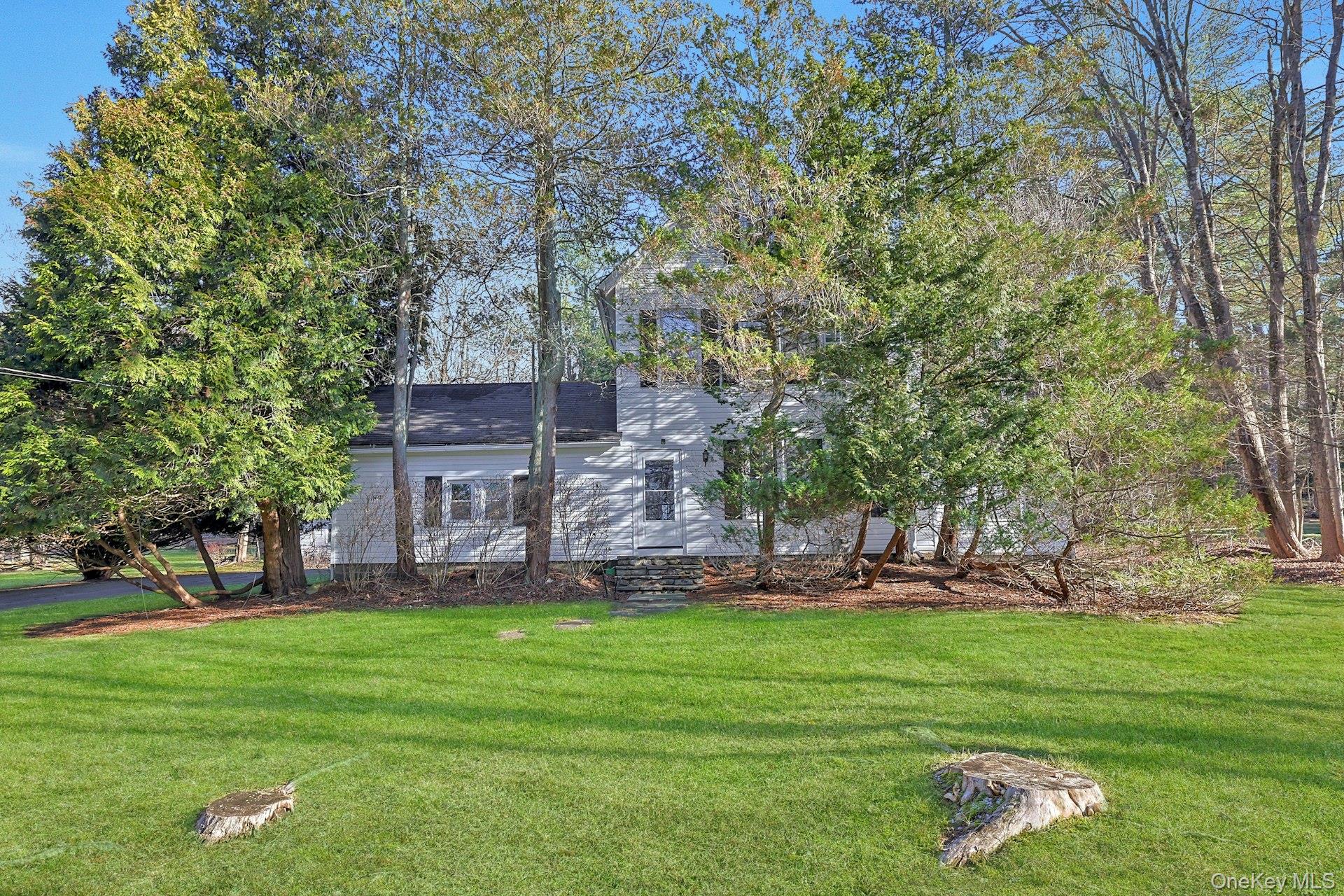 46 Mile Road Montebello, NY 10901 - Photo 27 of 27 a front view of a house with garden