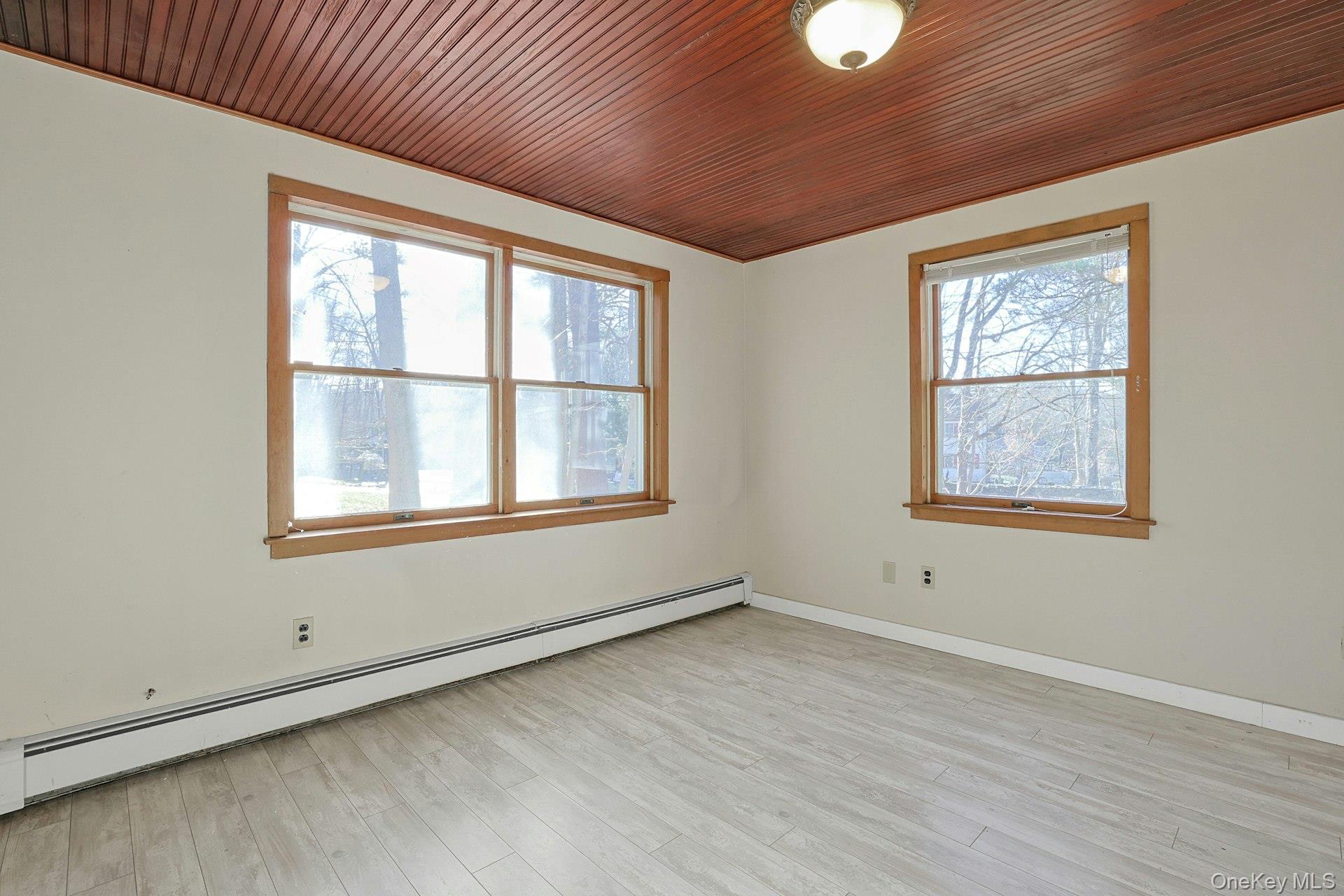 46 Mile Road Montebello, NY 10901 - Photo 9 of 27 a view of an empty room with wooden floor and a window