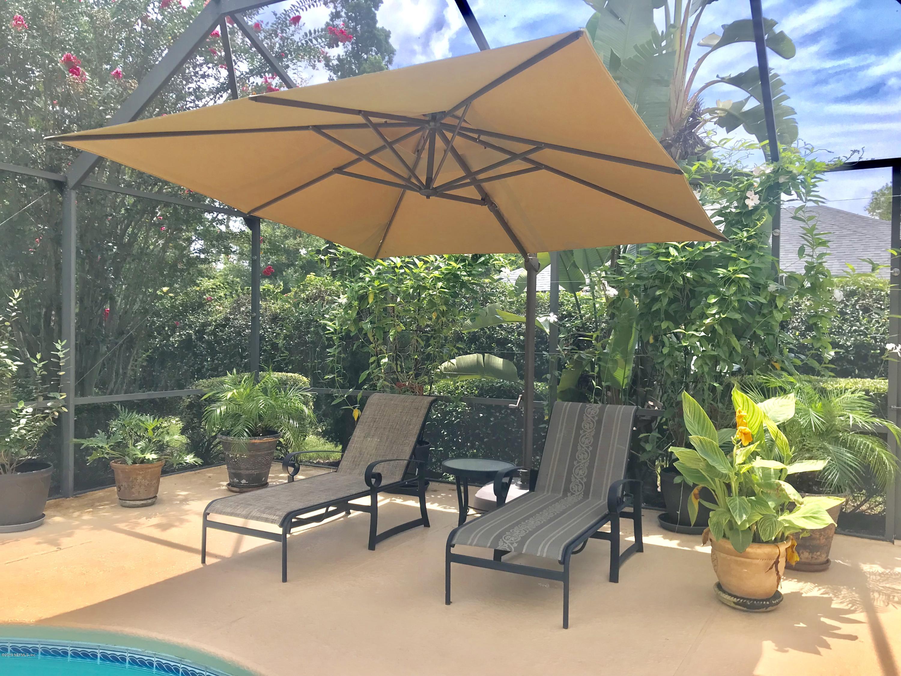 5030 Datil Pepper Road St. Augustine, FL 32086 - Photo 11 of 52 a backyard view with a seating space