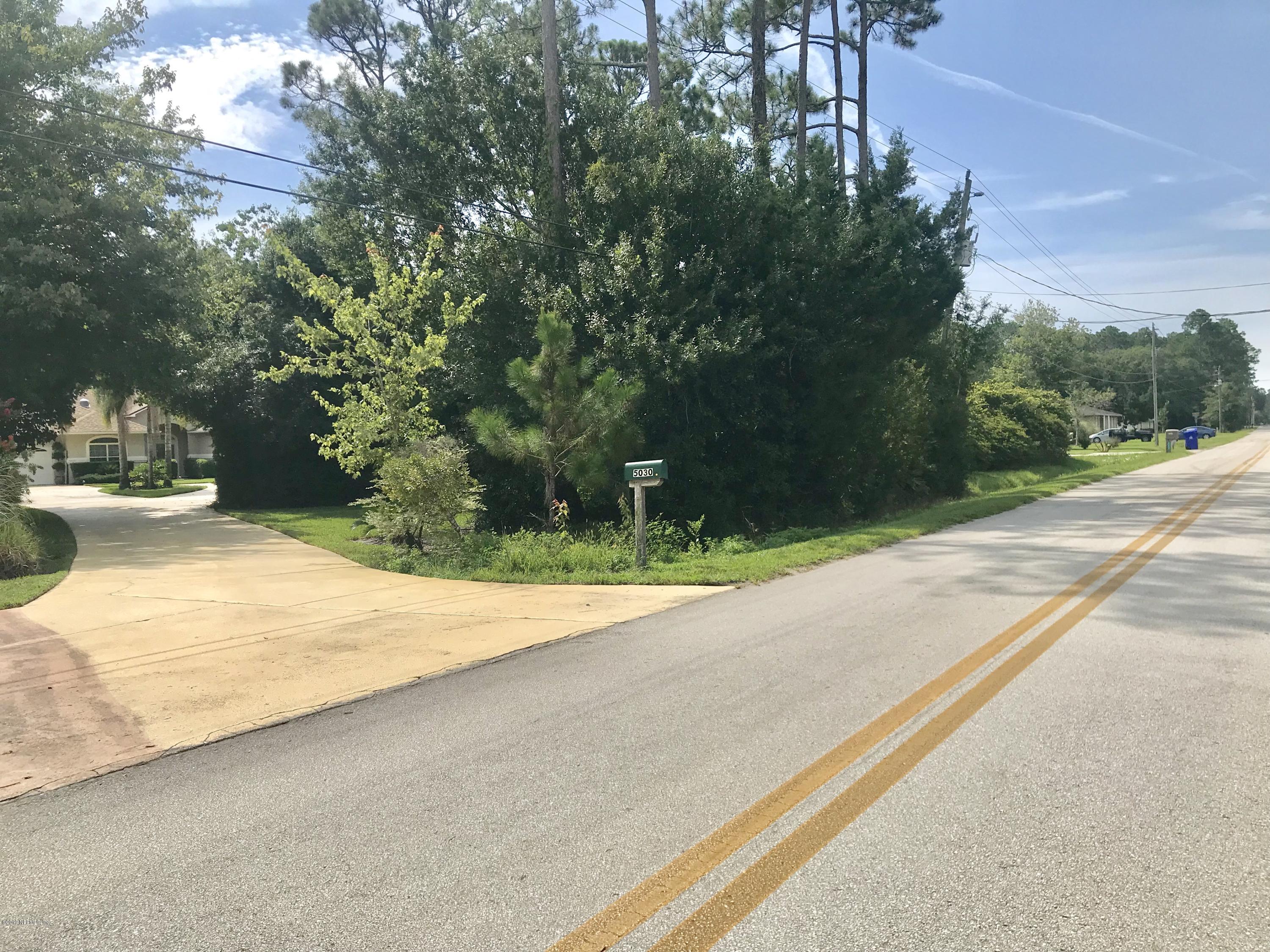 5030 Datil Pepper Road St. Augustine, FL 32086 - Photo 51 of 52 a backyard of a house with lots of green space