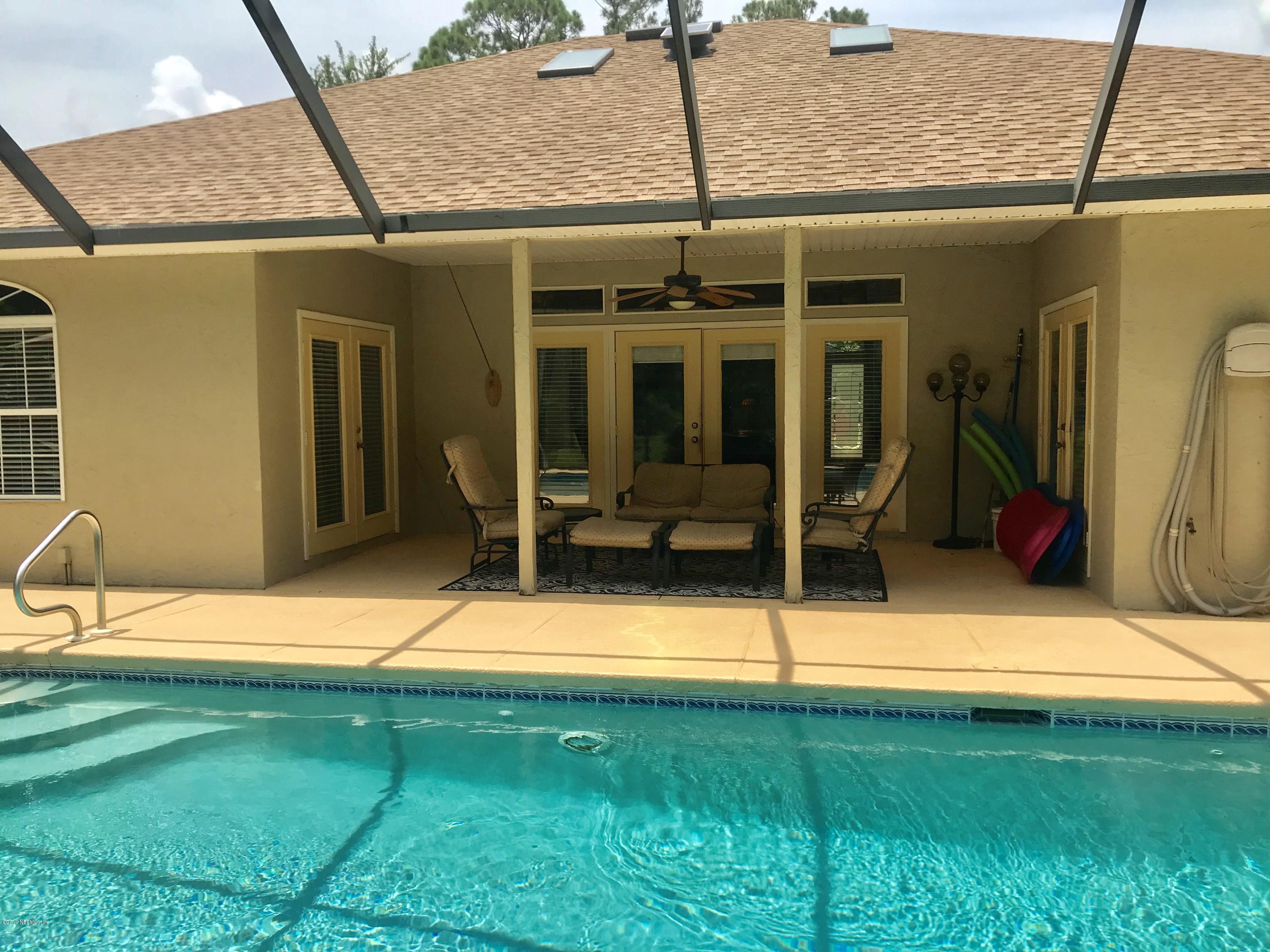 5030 Datil Pepper Road St. Augustine, FL 32086 - Photo 7 of 52 a backyard of a house with seating space