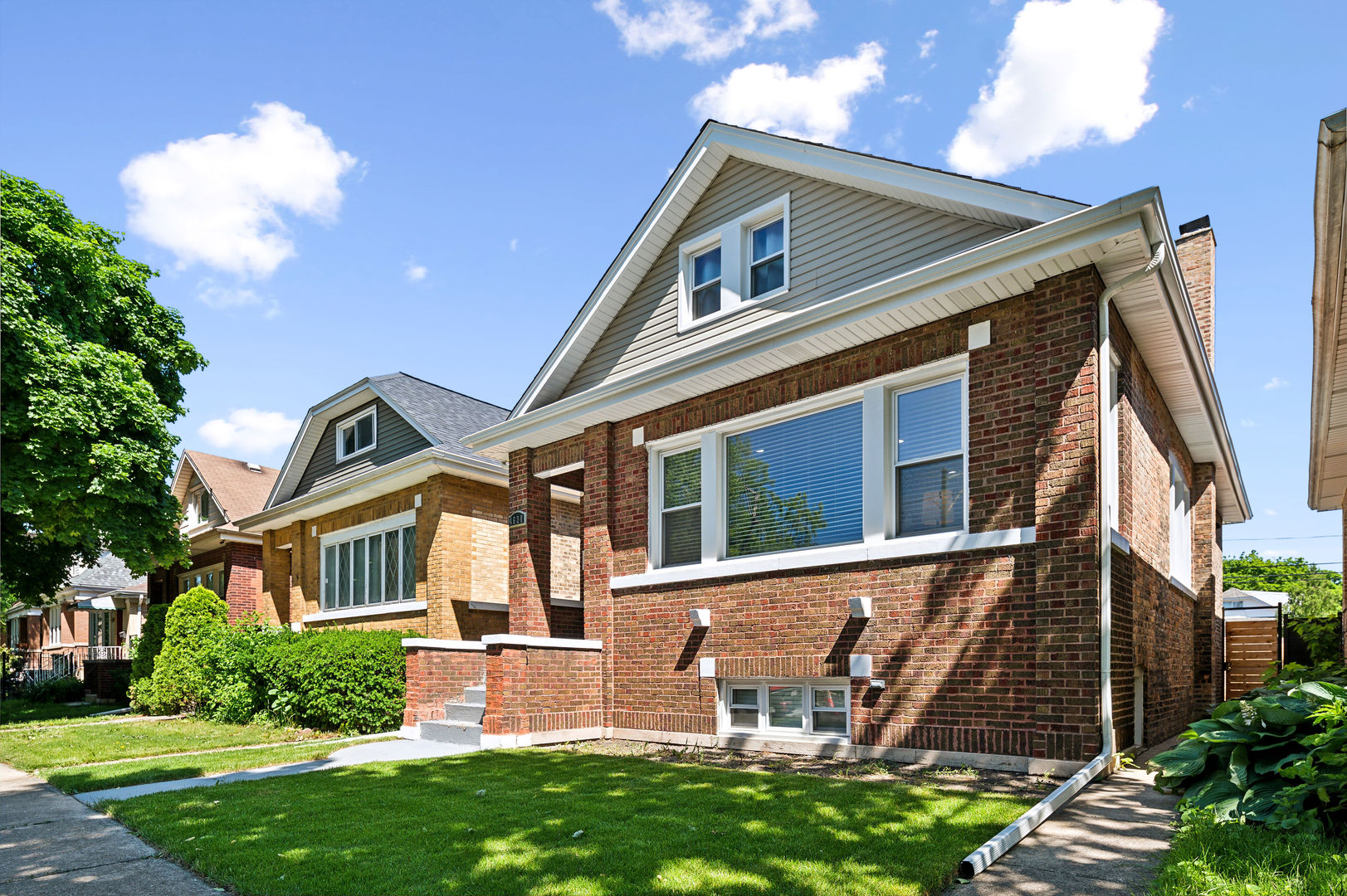 4630 West Montana Street Chicago, IL 60639 - Photo 1 of 38 a front view of a house with a yard