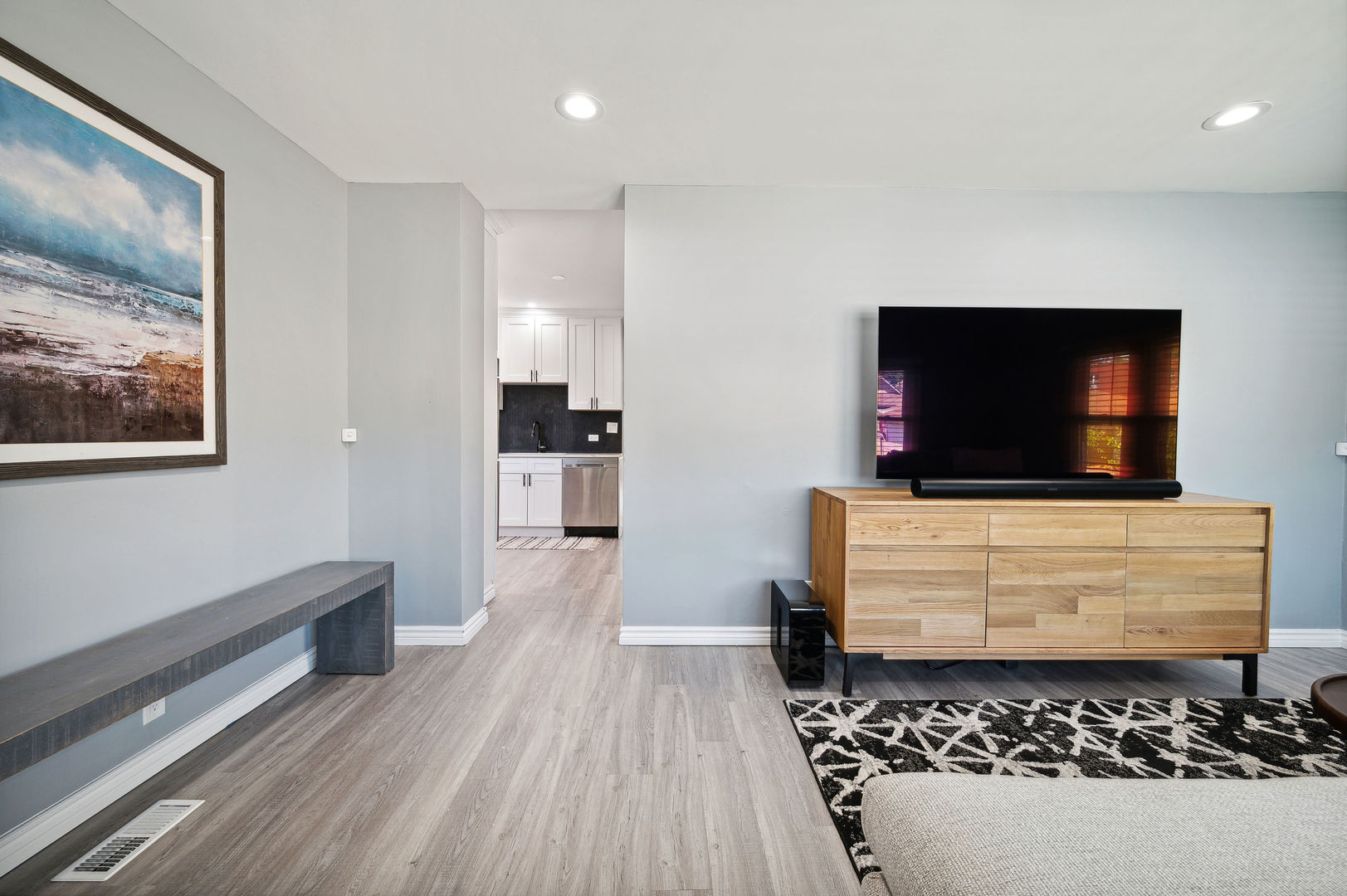 4630 West Montana Street Chicago, IL 60639 - Photo 14 of 38 a living room with furniture and a flat screen tv