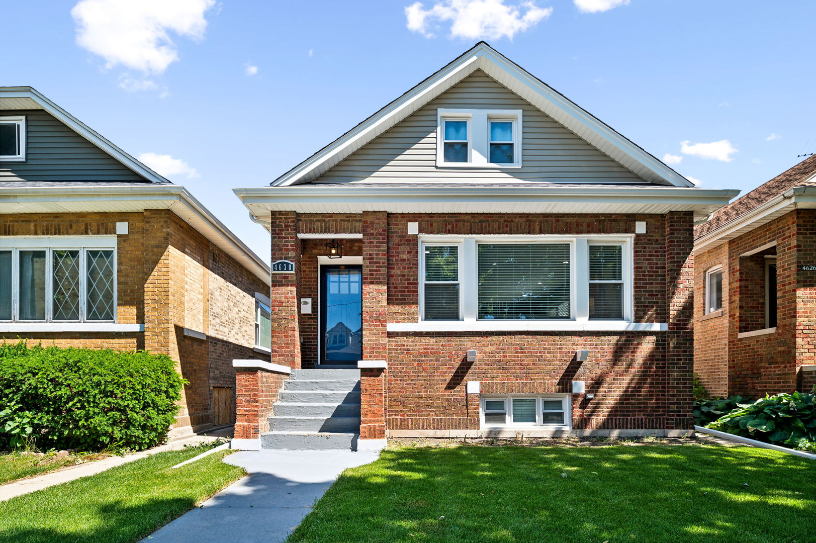 4630 West Montana Street Chicago, IL 60639 - Photo 2 of 38 a front view of a house with garden