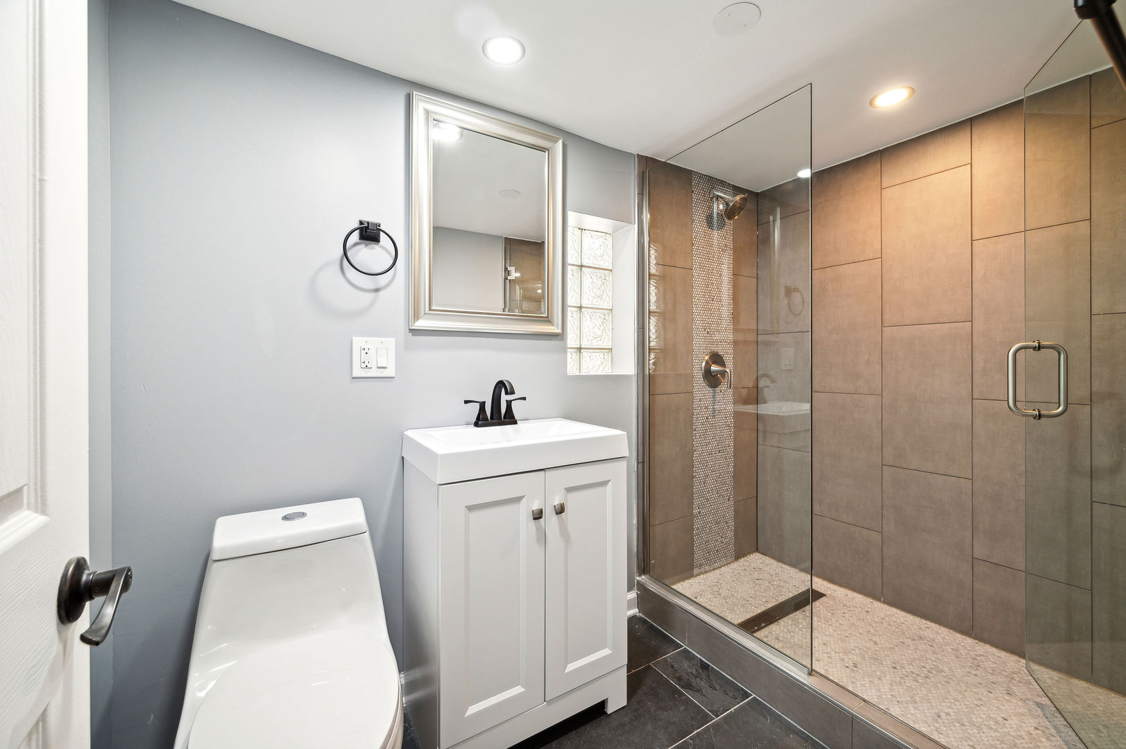 4630 West Montana Street Chicago, IL 60639 - Photo 28 of 38 a bathroom with a sink a toilet and shower