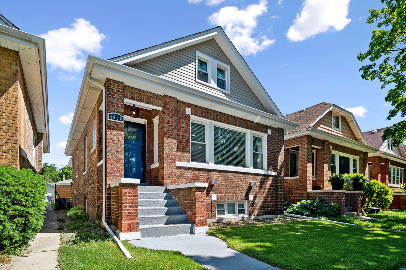 4630 West Montana Street Chicago, IL 60639 - Photo 3 of 38 front view of house with a yard