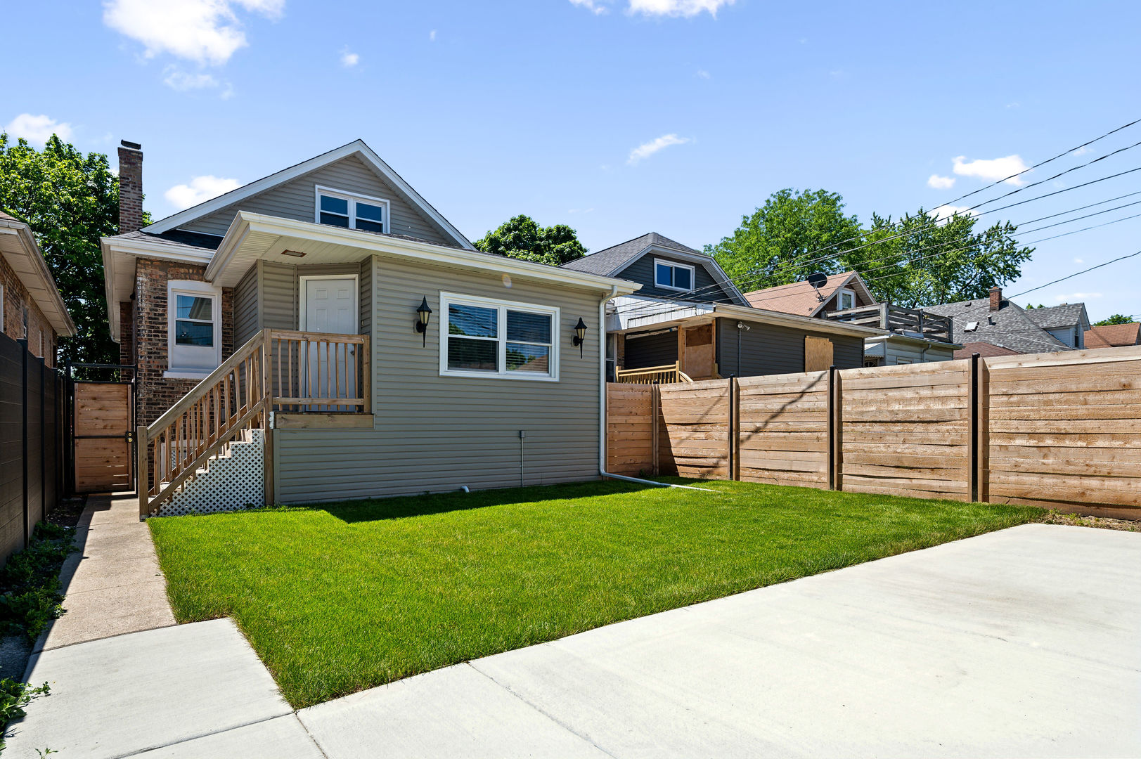 4630 West Montana Street Chicago, IL 60639 - Photo 32 of 38 a front view of house with yard and green space
