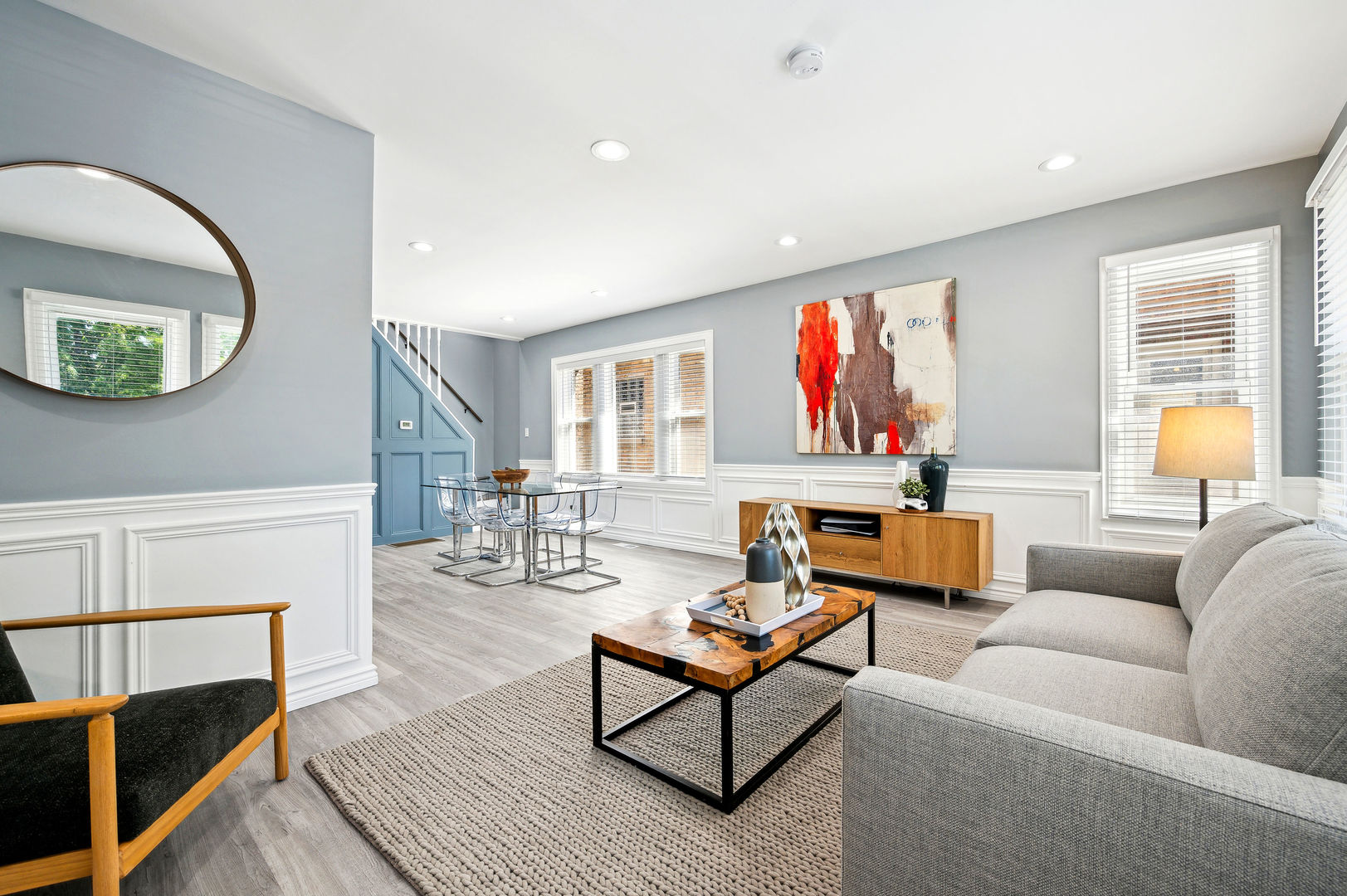 4630 West Montana Street Chicago, IL 60639 - Photo 4 of 38 a living room with furniture a rug and a painting on the wall