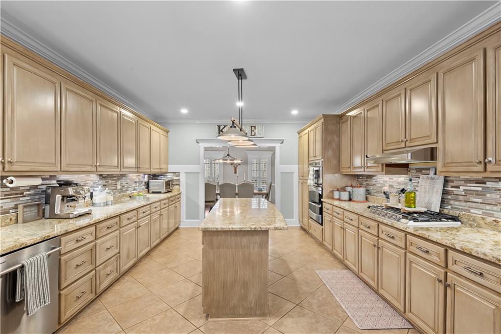 414 Parker Branch Road Barnesville, GA 30204 - Photo 22 of 101 a large kitchen with kitchen island granite countertop a large counter top a sink stainless steel appliances and cabinets