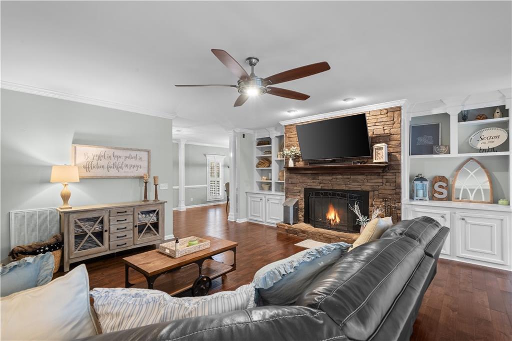 414 Parker Branch Road Barnesville, GA 30204 - Photo 29 of 101 a living room with furniture a fireplace and a flat screen tv