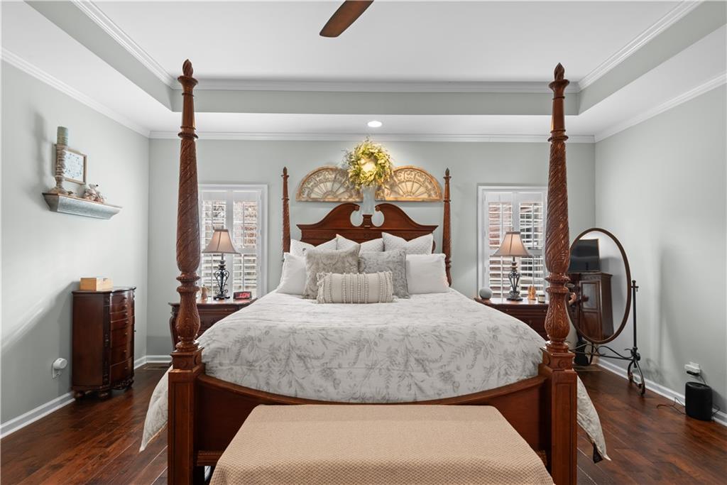 414 Parker Branch Road Barnesville, GA 30204 - Photo 34 of 101 a bedroom with a bed and a chandelier