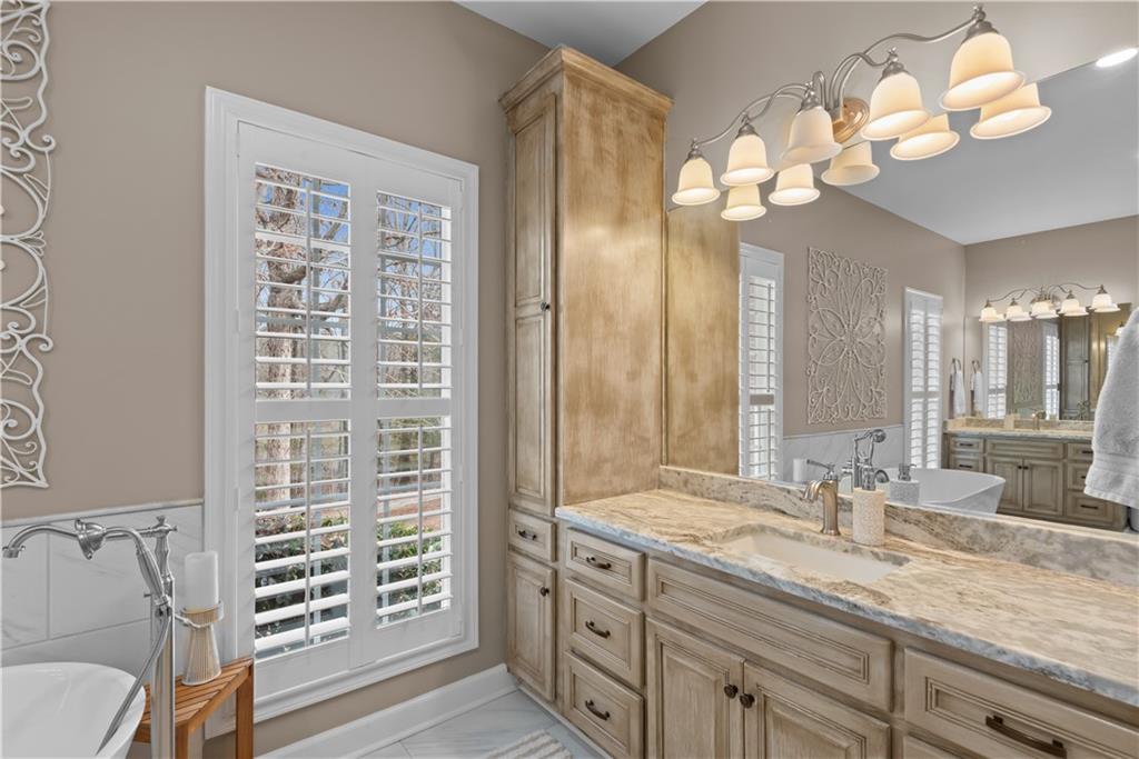 414 Parker Branch Road Barnesville, GA 30204 - Photo 37 of 101 a bathroom with a sink a vanity and a mirror