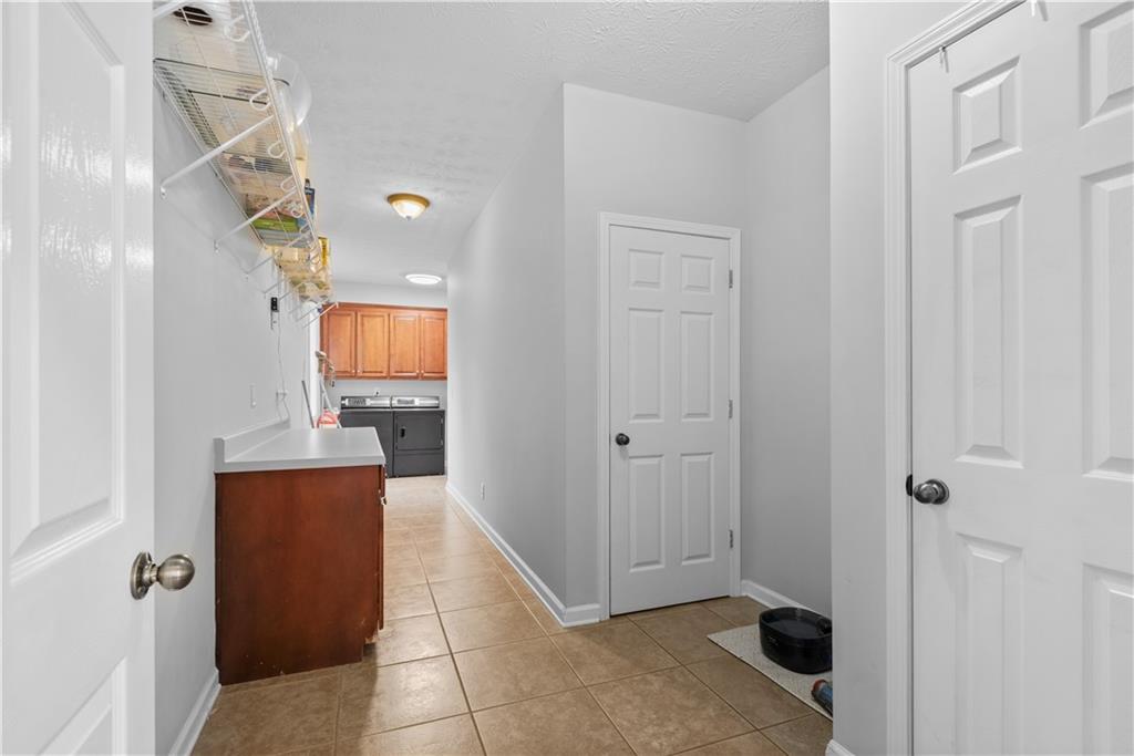 414 Parker Branch Road Barnesville, GA 30204 - Photo 55 of 101 a view of a hallway with wooden floor and staircase