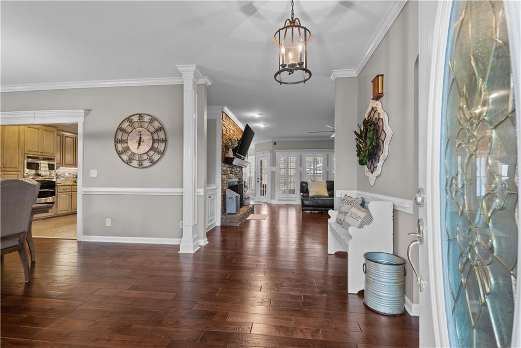 414 Parker Branch Road Barnesville, GA 30204 - Photo 7 of 101 a view of a dining room with furniture a chandelier and wooden floor