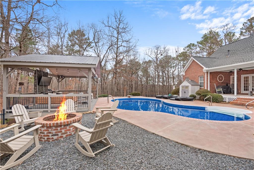 414 Parker Branch Road Barnesville, GA 30204 - Photo 72 of 101 a view of a house with swimming pool and sitting area