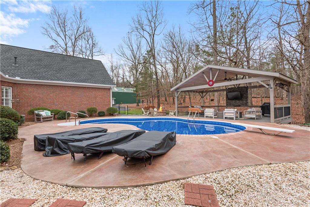 414 Parker Branch Road Barnesville, GA 30204 - Photo 74 of 101 a view of a house with swimming pool and sitting area