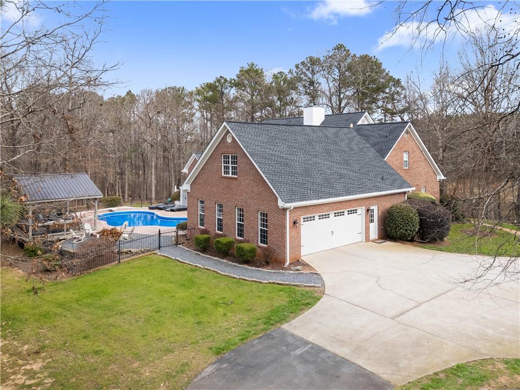 414 Parker Branch Road Barnesville, GA 30204 - Photo 81 of 101 a view of a house with backyard and sitting area