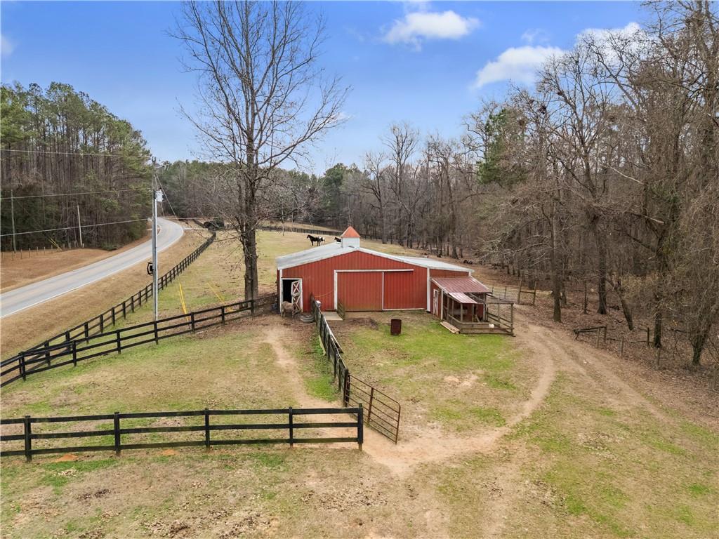 414 Parker Branch Road Barnesville, GA 30204 - Photo 96 of 101 a view of a swimming pool with a yard and large trees