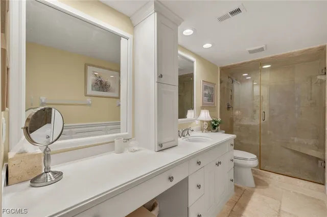 a spacious bedroom with two beds and a couch