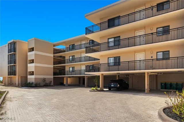 a view of a building with a parking space