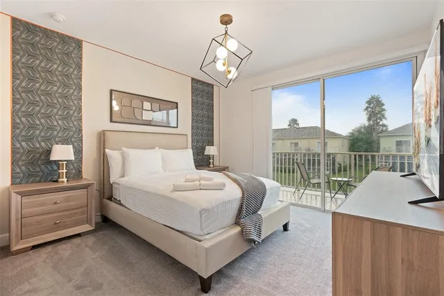 a spacious bedroom with a bed and a window