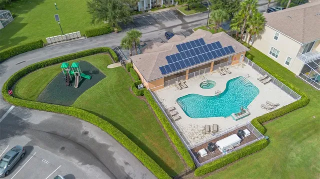 an aerial view of a backyard and a house