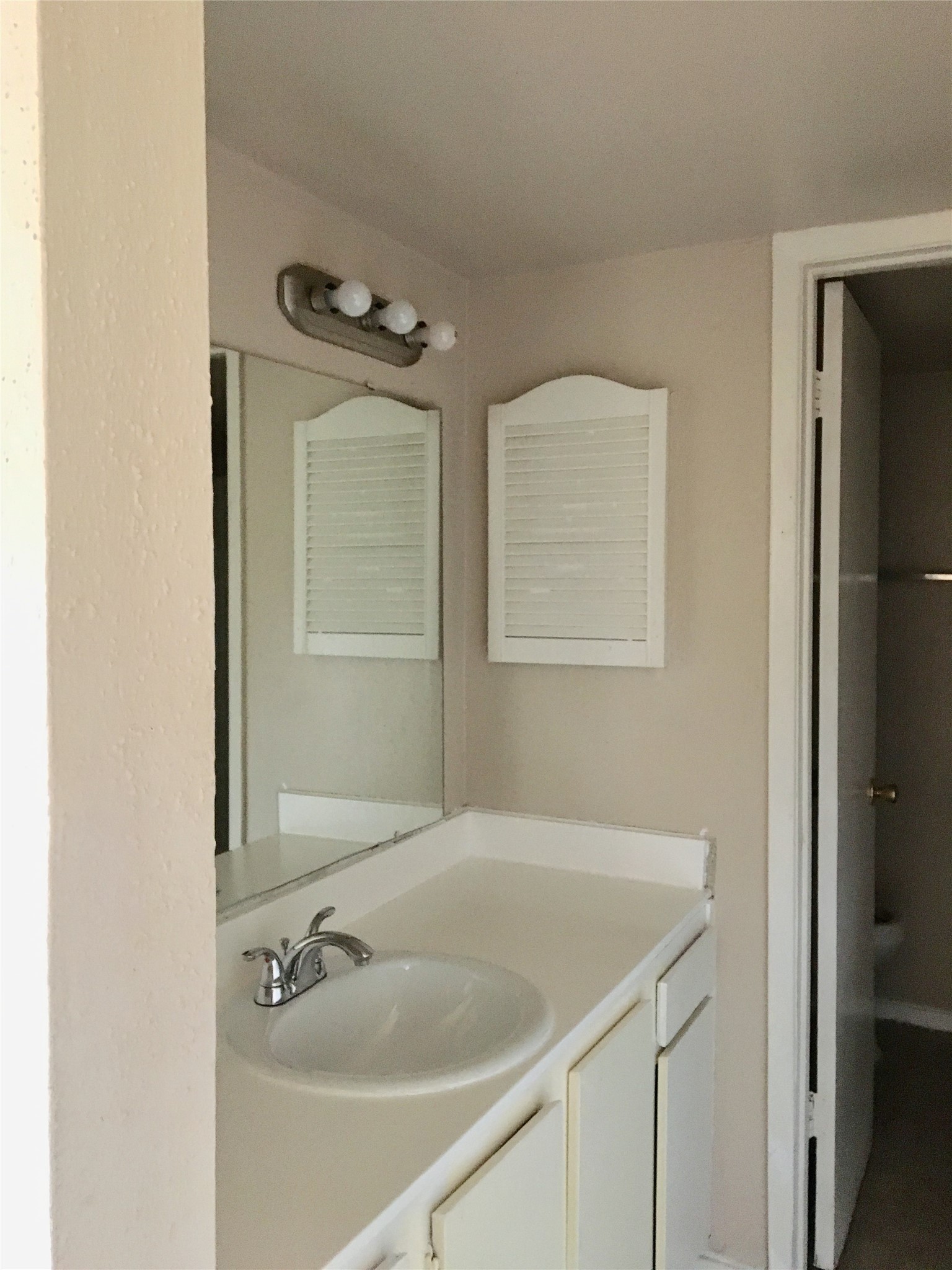 6200 West Tidwell Road, Unit 602 Houston, TX 77092 - Photo 6 of 9 a bathroom with a sink and a mirror