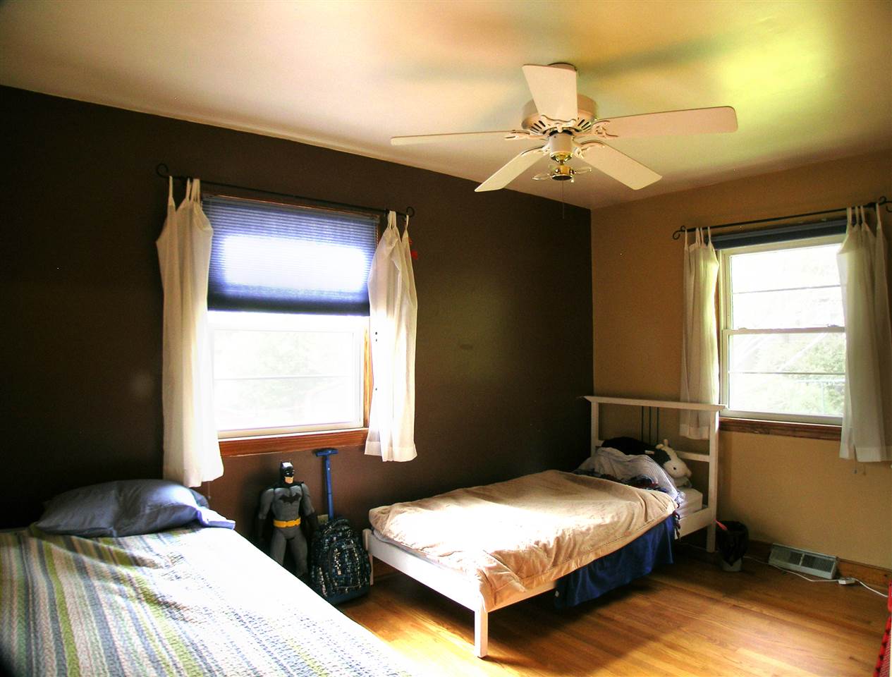 1244 Holmes Avenue Charlottesville, VA 22901 - Photo 11 of 19 a bedroom with two beds and a chandelier