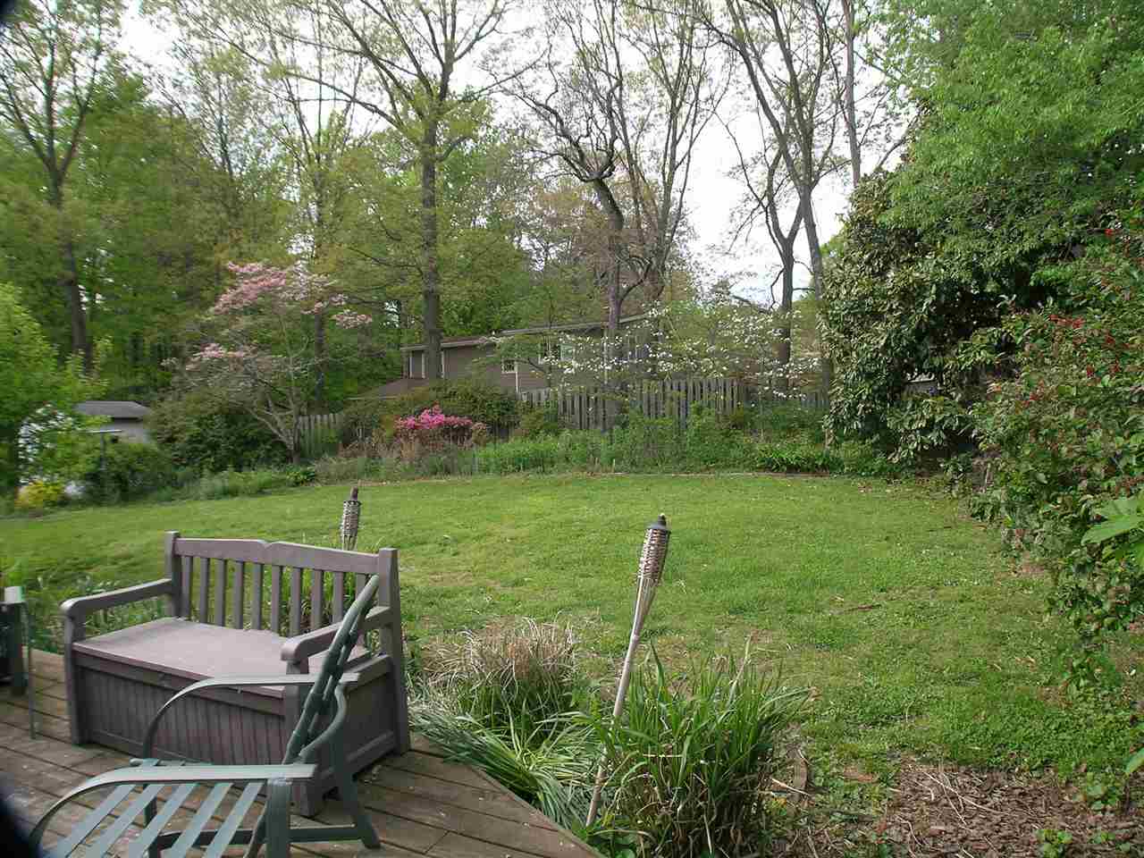 1244 Holmes Avenue Charlottesville, VA 22901 - Photo 16 of 19 a view of a chair and table on the wooden deck